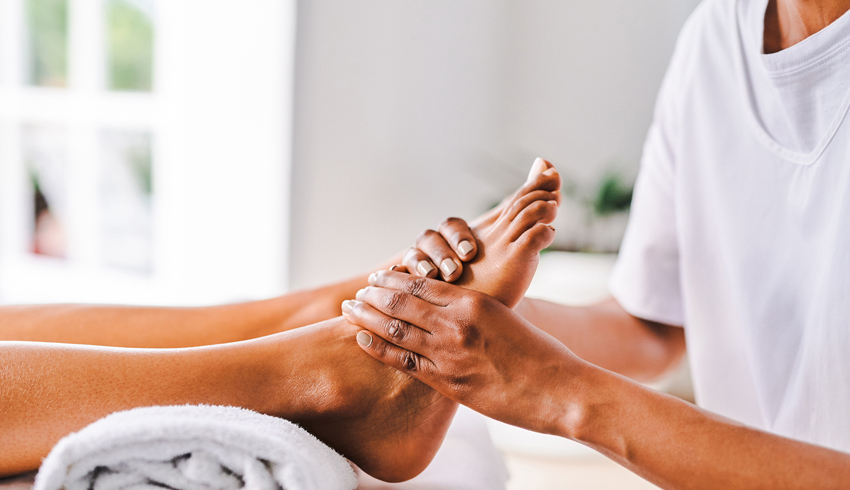 a woman receiving a foot massage
